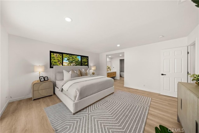 4700 Emerald Ave, La Verne, CA 91750 - bedroom featuring light wood-style flooring, recessed lighting, and connected bathroom