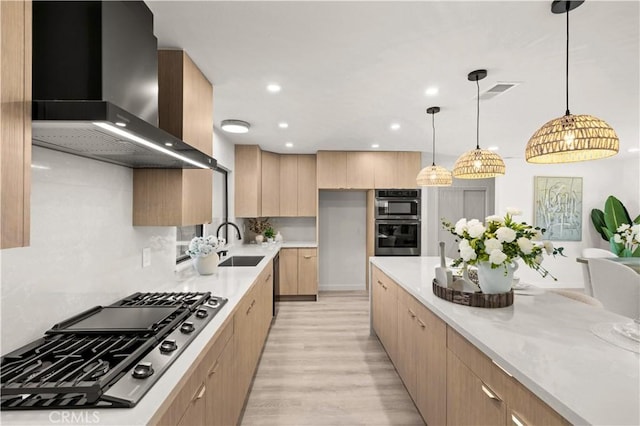4700 Emerald Ave, La Verne, CA 91750 - kitchen with wall chimney exhaust hood, stainless steel appliances, modern cabinets, light brown cabinetry, and recessed lighting