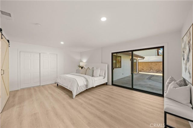 4700 Emerald Ave, La Verne, CA 91750 - bedroom with access to outside, a barn door, light wood finished floors, recessed lighting, and a closet