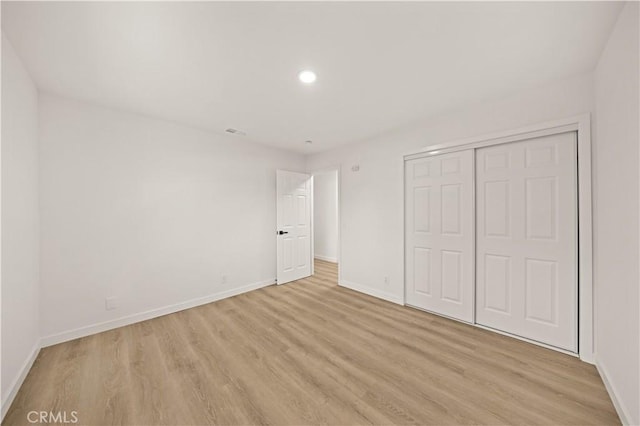 4700 Emerald Ave, La Verne, CA 91750 - unfurnished bedroom featuring light wood finished floors, a closet, and recessed lighting