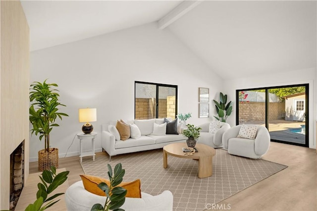 4700 Emerald Ave, La Verne, CA 91750 - living area featuring wood finished floors, beamed ceiling, high vaulted ceiling, and a fireplace
