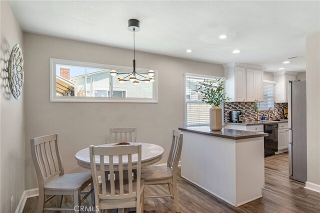 9099 Via Vista Dr, Buena Park, CA 90620 - dining area featuring dark wood finished floors, a chandelier, and recessed lighting