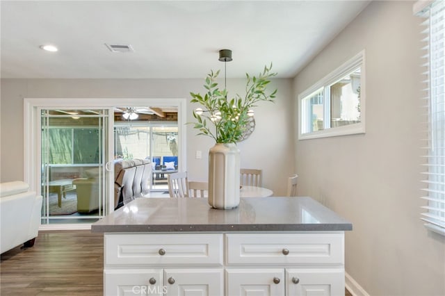 9099 Via Vista Dr, Buena Park, CA 90620 - kitchen featuring ceiling fan, white cabinetry, dark wood-style flooring, dark stone counters, and recessed lighting