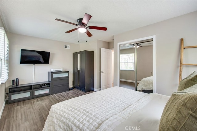 9099 Via Vista Dr, Buena Park, CA 90620 - bedroom with wood finished floors, a closet, and a ceiling fan