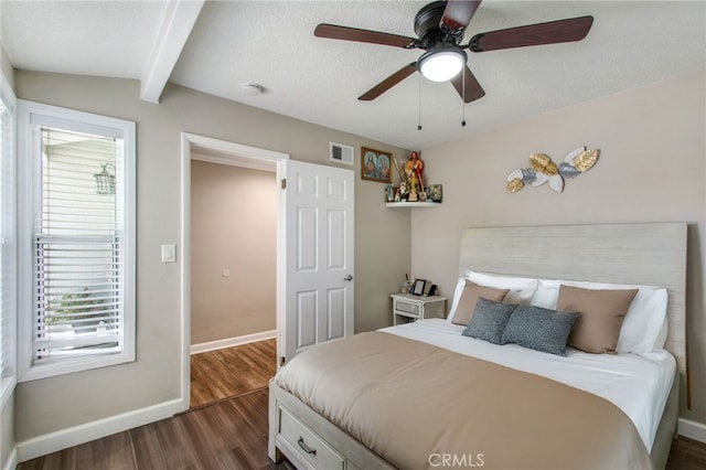 9099 Via Vista Dr, Buena Park, CA 90620 - bedroom featuring dark wood-style flooring, beam ceiling, and a ceiling fan