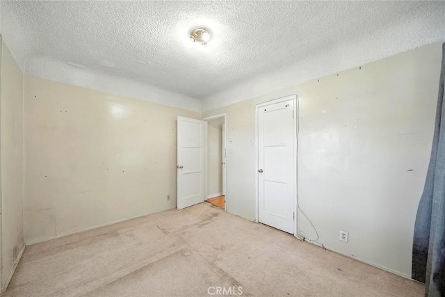 17229 Ardath Ave, Torrance, CA 90504 - unfurnished room featuring a textured ceiling and light carpet