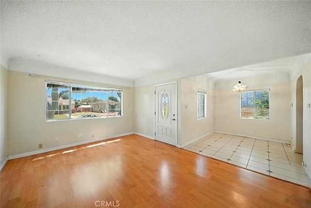 17229 Ardath Ave, Torrance, CA 90504 - entrance foyer with wood finished floors, plenty of natural light, and a textured ceiling