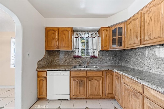17229 Ardath Ave, Torrance, CA 90504 - kitchen with dishwasher, arched walkways, glass insert cabinets, and light tile patterned floors