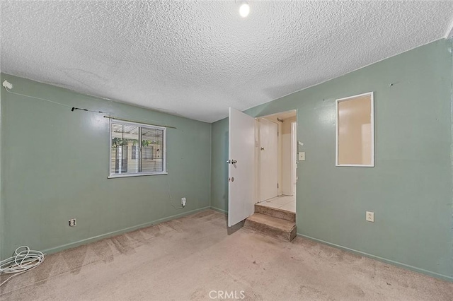 17229 Ardath Ave, Torrance, CA 90504 - unfurnished bedroom with a textured ceiling and carpet flooring