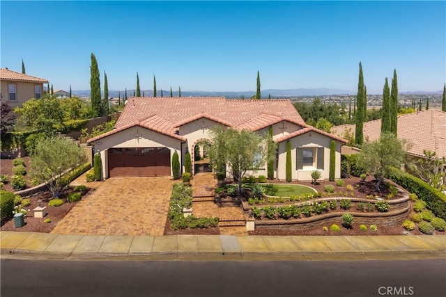 44277 Reidel St, Temecula, CA 92592 - mediterranean / spanish house with a garage, a tiled roof, stucco siding, and driveway