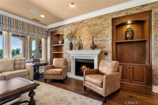 44277 Reidel St, Temecula, CA 92592 - living room featuring crown molding, dark wood-type flooring, a lit fireplace, and recessed lighting