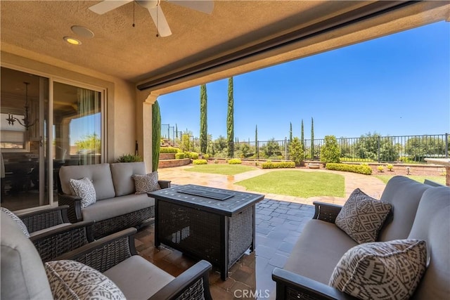 44277 Reidel St, Temecula, CA 92592 - fenced backyard featuring a patio, an outdoor hangout area, and a ceiling fan