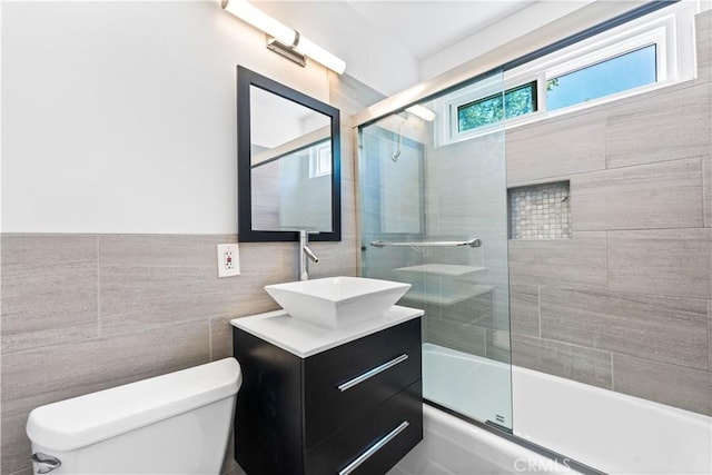 7135 Coldwater Canyon Ave Unit 16, North Hollywood, CA 91605 - bathroom with vanity, shower / bath combination with glass door, and tile walls