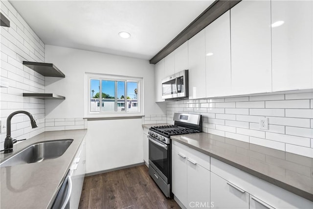 7135 Coldwater Canyon Ave Unit 16, North Hollywood, CA 91605 - kitchen featuring stainless steel appliances, dark wood finished floors, open shelves, white cabinetry, and recessed lighting