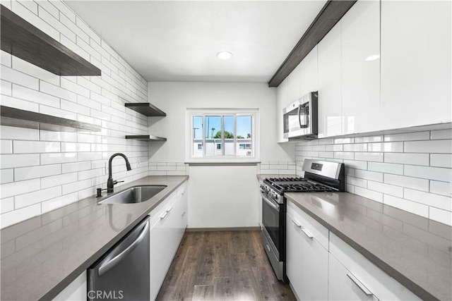 7135 Coldwater Canyon Ave Unit 16, North Hollywood, CA 91605 - kitchen featuring appliances with stainless steel finishes, open shelves, backsplash, dark wood finished floors, and recessed lighting