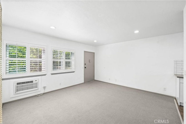 7135 Coldwater Canyon Ave Unit 16, North Hollywood, CA 91605 - unfurnished living room with recessed lighting, carpet flooring, and an AC wall unit