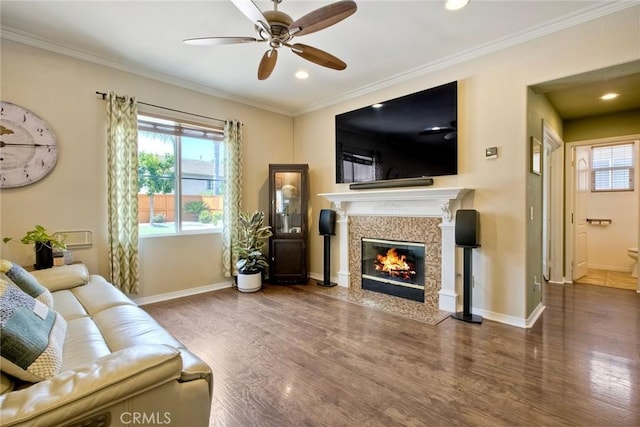 32839 Tiempo Cir, Temecula, CA 92592 - living area with wood finished floors, healthy amount of natural light, a fireplace with flush hearth, ceiling fan, and recessed lighting