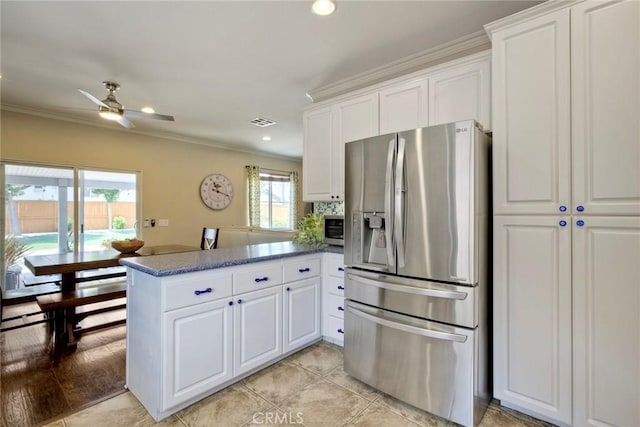 32839 Tiempo Cir, Temecula, CA 92592 - kitchen featuring appliances with stainless steel finishes, a peninsula, plenty of natural light, white cabinetry, and ornamental molding