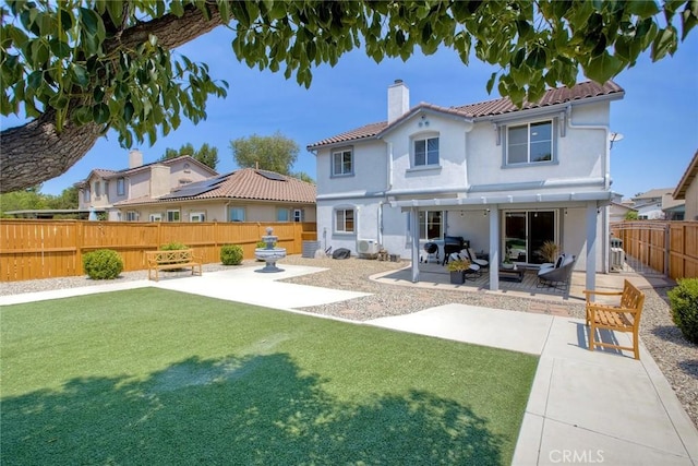32839 Tiempo Cir, Temecula, CA 92592 - rear view of property with a patio area, a chimney, stucco siding, a tiled roof, and a fenced backyard