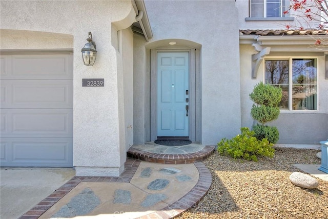 32839 Tiempo Cir, Temecula, CA 92592 - property entrance with a garage and stucco siding