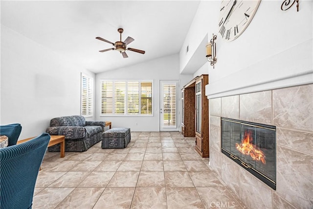 23681 Corte Sabio, Murrieta, CA 92562 - living area with vaulted ceiling, ceiling fan, a tiled fireplace, and light tile patterned flooring