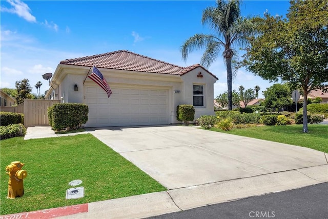 23681 Corte Sabio, Murrieta, CA 92562 - mediterranean / spanish-style home featuring a tile roof, an attached garage, a front yard, stucco siding, and driveway