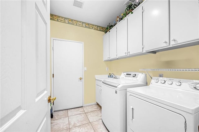 23681 Corte Sabio, Murrieta, CA 92562 - laundry room with independent washer and dryer, cabinet space, and light tile patterned floors