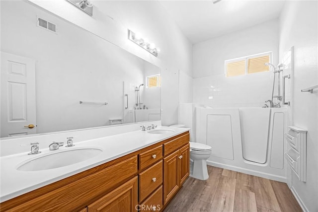 23681 Corte Sabio, Murrieta, CA 92562 - full bathroom with double vanity, wood finished floors, a shower, and a bathtub