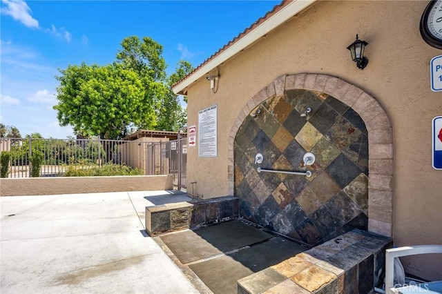 23681 Corte Sabio, Murrieta, CA 92562 - doorway to property with stucco siding