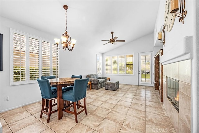 23681 Corte Sabio, Murrieta, CA 92562 - dining area with a tile fireplace, a ceiling fan, lofted ceiling, a chandelier, and light tile patterned flooring
