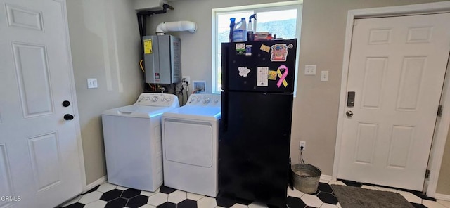 4141 Willow Trl, Frazier Park, CA 93225 - washroom featuring washer and clothes dryer, water heater, and light flooring