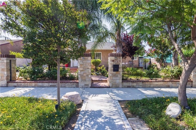 14724 Maclay St, San Fernando, CA 91345 - obstructed view of property with stucco siding