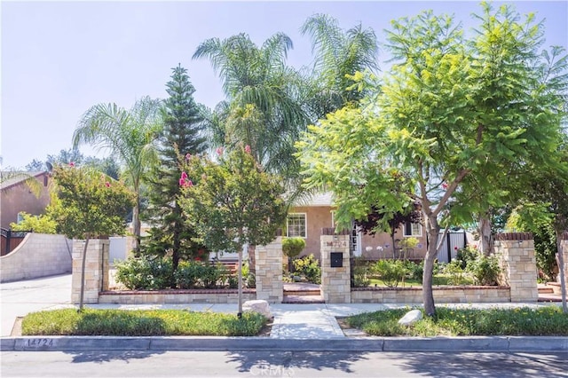 14724 Maclay St, San Fernando, CA 91345 - obstructed view of property featuring stucco siding