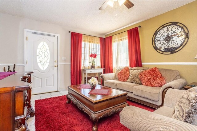 14724 Maclay St, San Fernando, CA 91345 - living area featuring a textured ceiling, light tile patterned floors, and ceiling fan