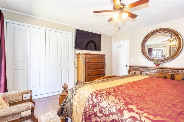 14724 Maclay St, San Fernando, CA 91345 - bedroom with a closet, wood finished floors, a textured ceiling, and ceiling fan