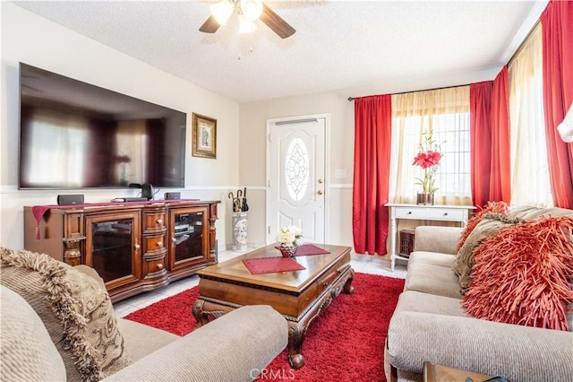 14724 Maclay St, San Fernando, CA 91345 - living area featuring a ceiling fan, a textured ceiling, and tile patterned floors