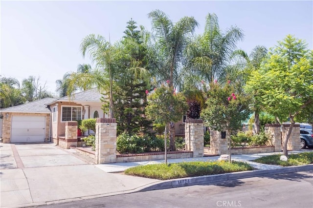 14724 Maclay St, San Fernando, CA 91345 - view of front of property featuring a garage and concrete driveway