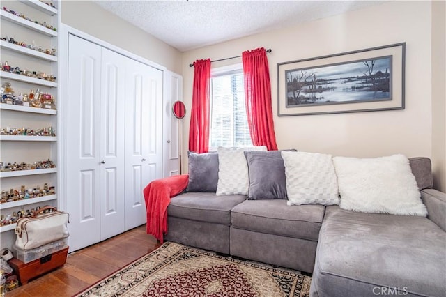 14724 Maclay St, San Fernando, CA 91345 - living room with wood finished floors and a textured ceiling