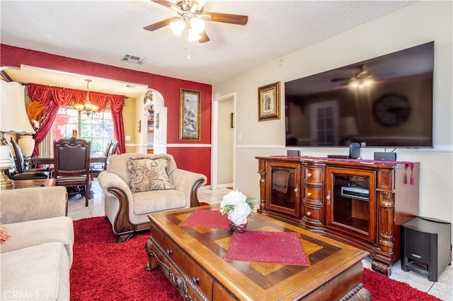 14724 Maclay St, San Fernando, CA 91345 - tiled living area featuring a ceiling fan, a chandelier, and a textured ceiling