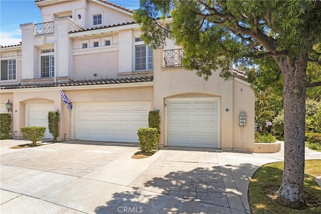 75 Shorebreaker Dr, Laguna Niguel, CA 92677 - mediterranean / spanish house with decorative driveway, stucco siding, a garage, and a tiled roof