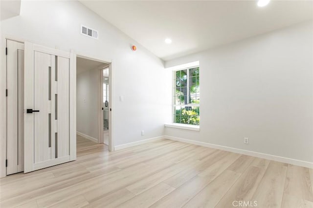 13119 Constable Ave, Granada Hills, CA 91344 - unfurnished room with light wood-style flooring, lofted ceiling, and recessed lighting