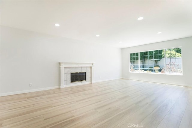 13119 Constable Ave, Granada Hills, CA 91344 - unfurnished living room featuring light wood-type flooring, recessed lighting, and a fireplace