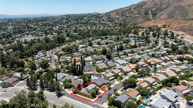13119 Constable Ave, Granada Hills, CA 91344 - aerial overview of property's location with property parcel outlined, a mountainous background, and nearby suburban area