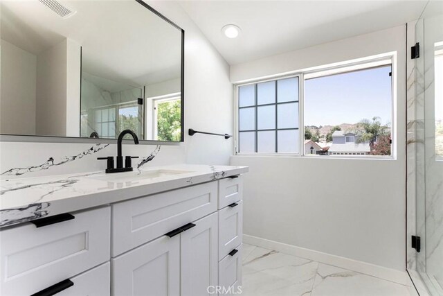 13119 Constable Ave, Granada Hills, CA 91344 - full bathroom with marble look tiles, vanity, a marble finish shower, and recessed lighting