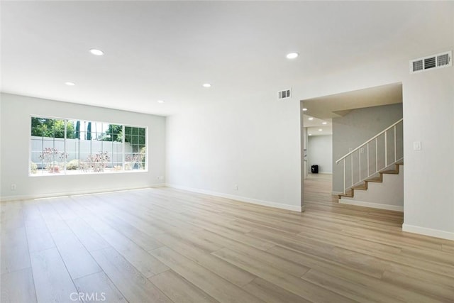 13119 Constable Ave, Granada Hills, CA 91344 - empty room featuring light wood-style floors, stairway, and recessed lighting