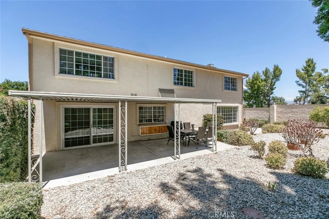 13119 Constable Ave, Granada Hills, CA 91344 - rear view of house featuring stucco siding and a patio