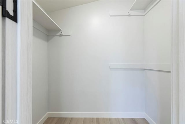13119 Constable Ave, Granada Hills, CA 91344 - spacious closet featuring light wood-style floors