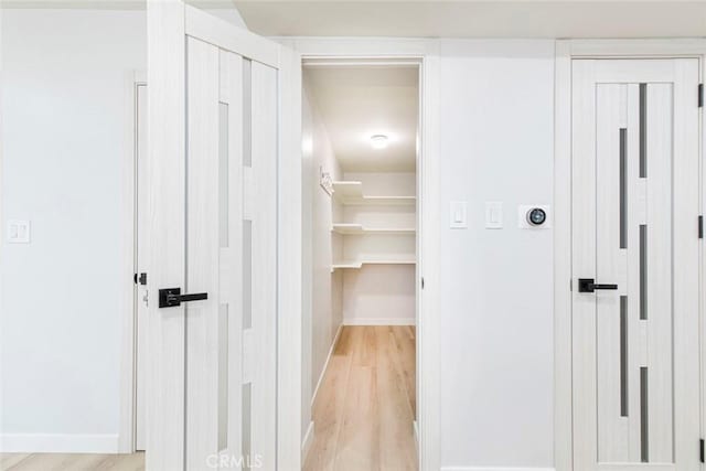 13119 Constable Ave, Granada Hills, CA 91344 - corridor with light wood-type flooring and baseboards