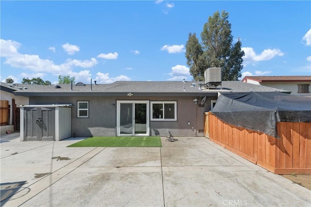 5080 Pearblossom, Riverside, CA 92507 - back of house with stucco siding, a patio area, a fenced backyard, a storage unit, and roof with shingles