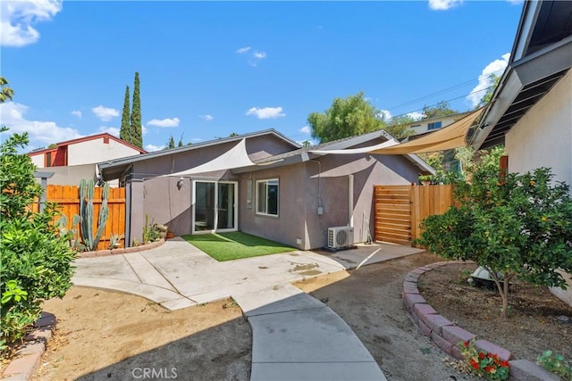 5080 Pearblossom, Riverside, CA 92507 - rear view of house with stucco siding and a patio